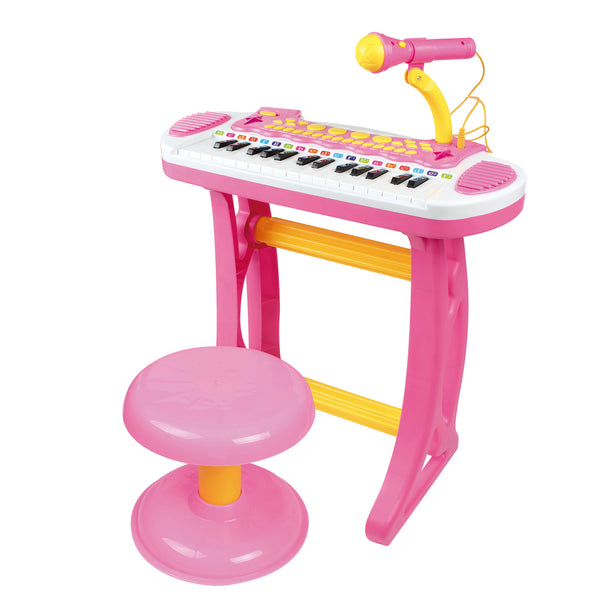 Piano keyboard with stool, working microphone and bright flashlight, pink